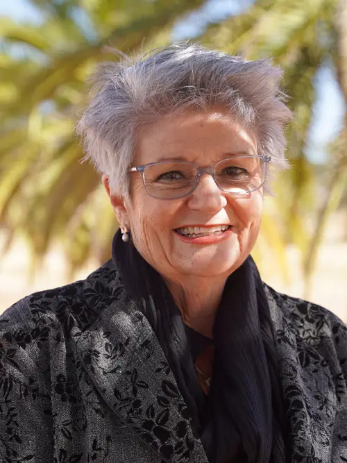 Portrait of Jeanetta Vermaak smiling outdoors